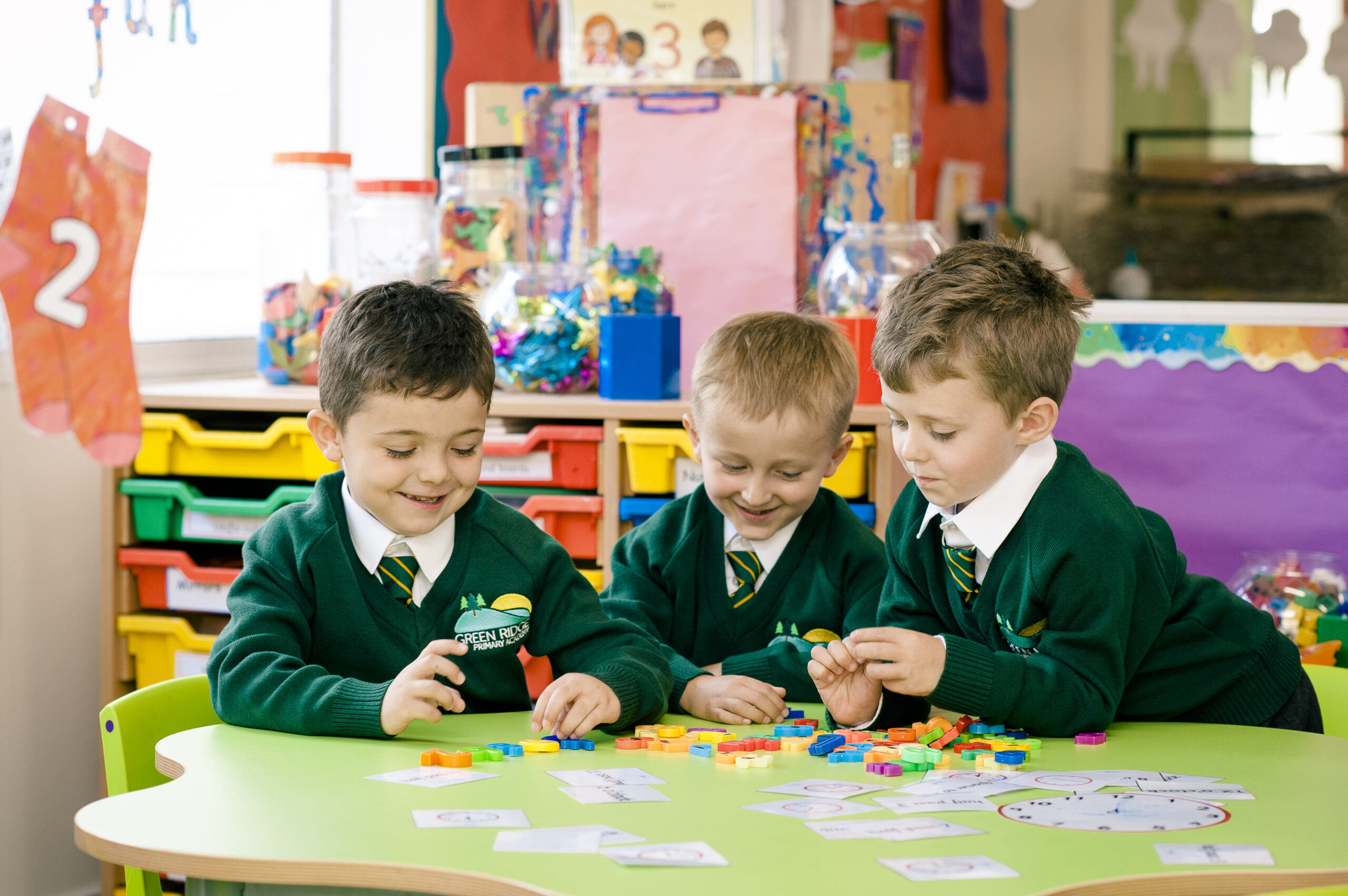 A photo of three children from Green Ridge Academy playing.